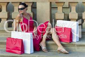 Woman In Red Dress With Shopping Bags