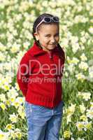 Little Girl Playing In Daffodils
