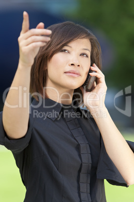Woman On Cell Phone and Pointin