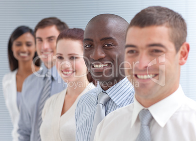 Business team in a line. Focus on an Afro-American man