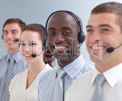 Afro-American businessman working in a call center in a line