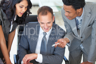 Manager with employees working in office