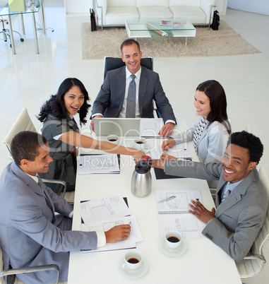 Business people shaking hands in a meeting