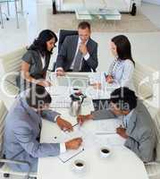 High angle of businessteam working in a meeting