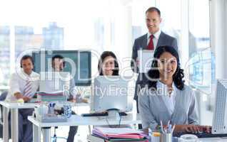 Supervisor writing notes in a call center