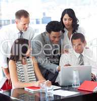 Business people working together with a laptop