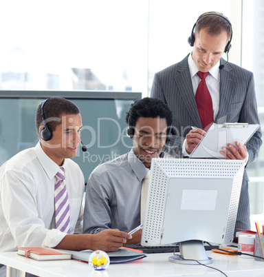 Manager and businessmen working in call center