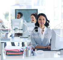 Beautiful businesswoman working in a call center