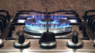 Flames of a gas stove in the kitchen