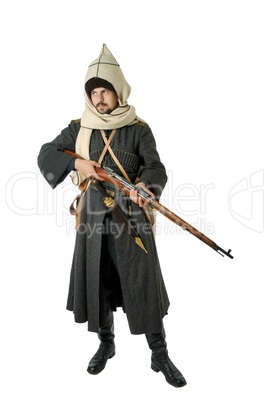 Man in vintage costume of Russian Cossack with rifle.