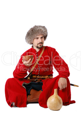 Tatar warrior sitting with cup and calabash.