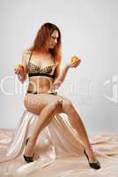 Undressed woman with fruit