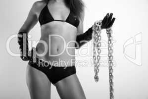 Female body in black with chain