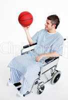 Patient in wheelchair with a basket ball