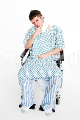 Patient sitting in a wheelchair with a neck brace in hospital