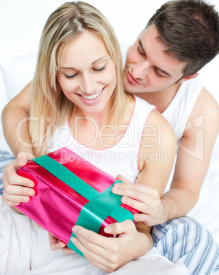 Boyfriend giving a gift to her girlfriend