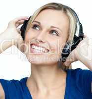 Portrait of a woman listening to music with headphones on