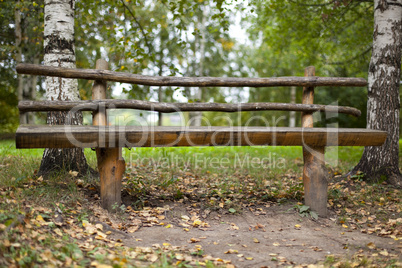 Wood bench in forest - small depth of field