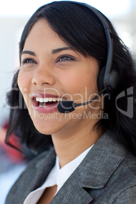 Smiling businesswoman in a call center