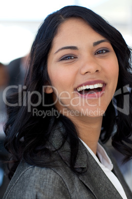 Portrait of smiling ethnic businesswoman in office