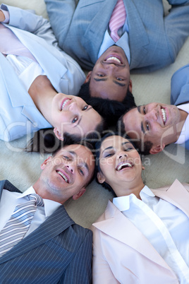 Business team on floor in a circle