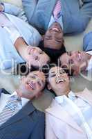 Business team on floor in a circle