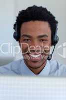 Portrait of a smiling Afro-American businessman in a call center