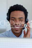 Afro-American young businessman in a call center