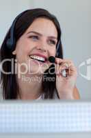 Smiling businesswoman in a call centre