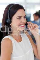 Businesswoman talking on a headset in a call centre