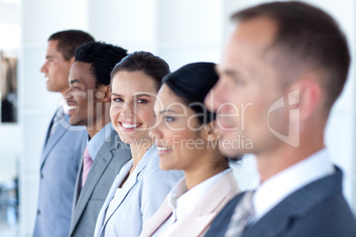 Attractive businesswoman with her team in a row