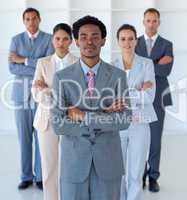Afro-American businessman in front of his team