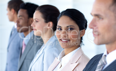 Confident businesswoman with her team in a line