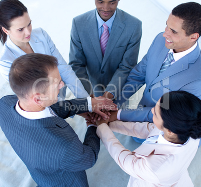 Multi-ethnic business team with hands together