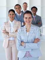 Businesswoman with her team smiling at the camera