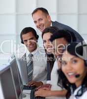 Manager with his business team working in a call center
