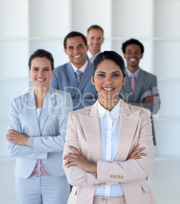Business team standing in office looking at the camera
