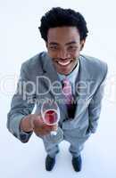 Smiling Afro-American businessman holding a glass of wine