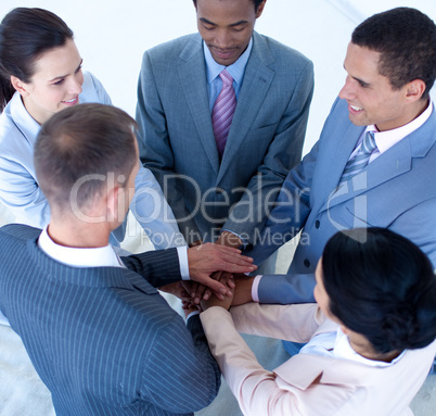 International business team with hands together