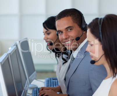 Smiling businessman in a call canter