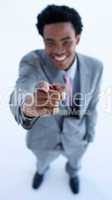 Smiling African businessman pointing at the camera