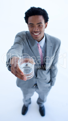 Afro-American businessman holding a glass of water
