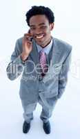 Smiling businessman speaking on a mobile phone