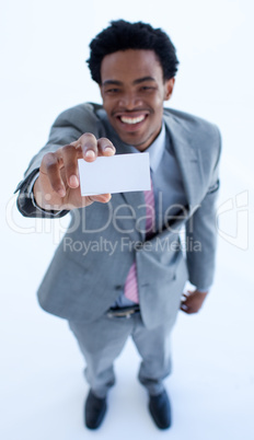 Smiling Afro-American businessman holding a business card