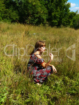 sexual girl has a rest in the field