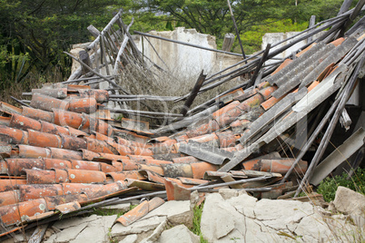 Collapsed house with terra cotta tile roof