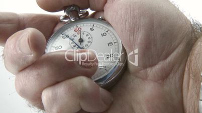 Stopwatch in hand counting the time