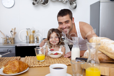 Daughter having breakfast with her father