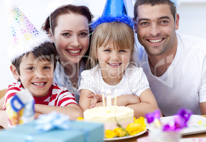 Smiling family celebrating a birthday