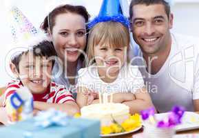Smiling family celebrating a birthday